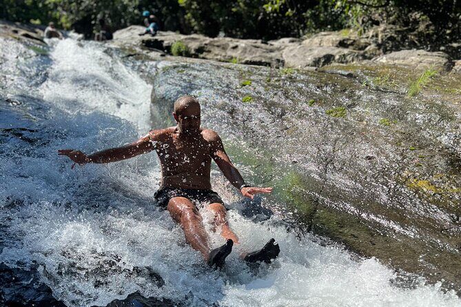 El Yunque Waterslide and Waterfall Tour with Food and Photos - The safety vibe: life jackets, socks, and a guide who stays close
